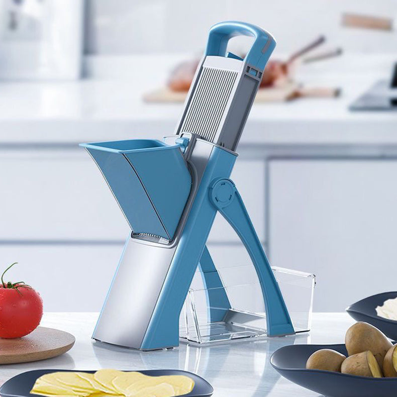 Blue and silver mandoline slicer on a kitchen counter with vegetables