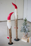SET OF TWO WOOD AND PAINTED METAL SANTAS WITH ROPE ARMS
