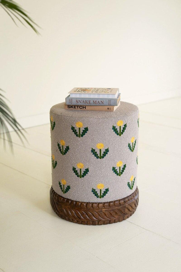 UPHOLSTERED OTTOMAN WITH CARVED WOOD BASE - GREY