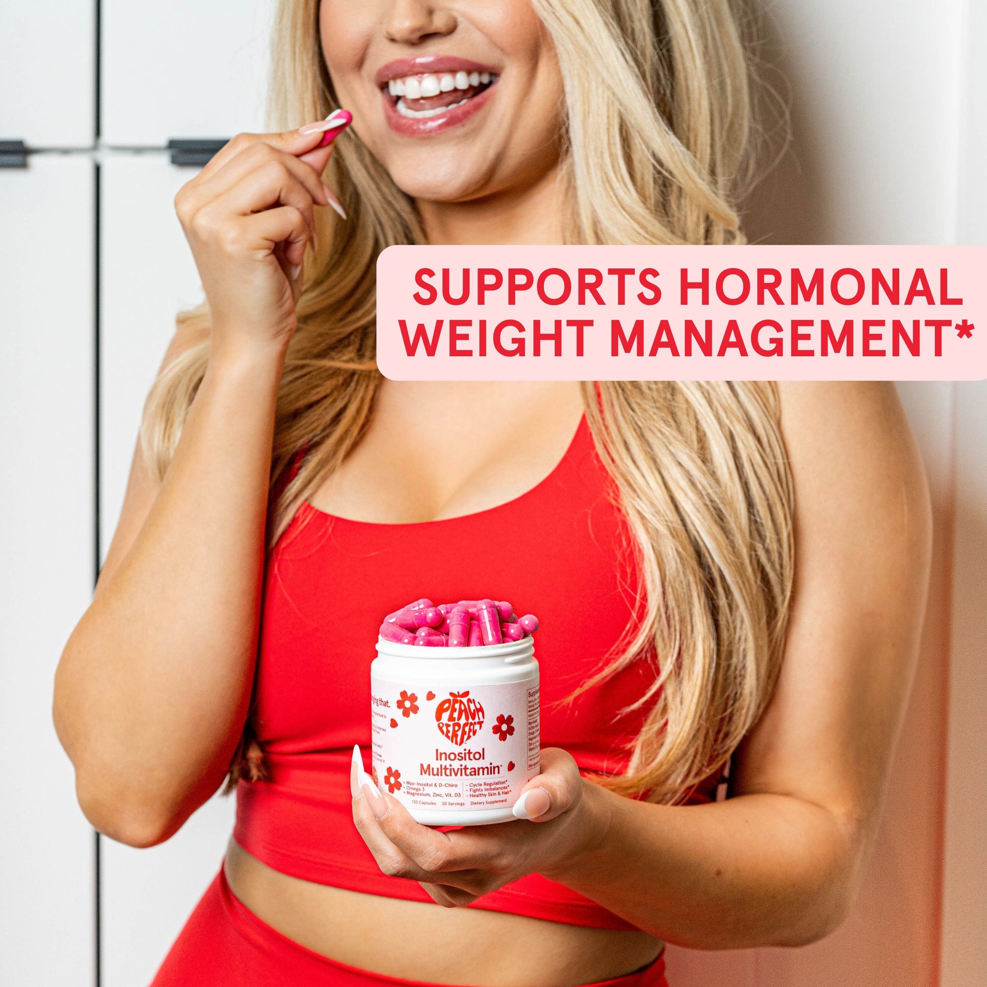 Woman holding a supplement container with text about hormonal weight management.