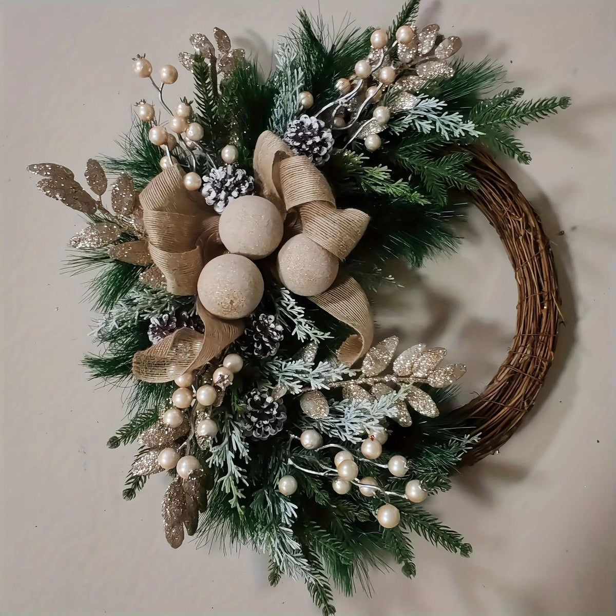 Plastic Christmas Wreath with Golden Accents and Pine Cones