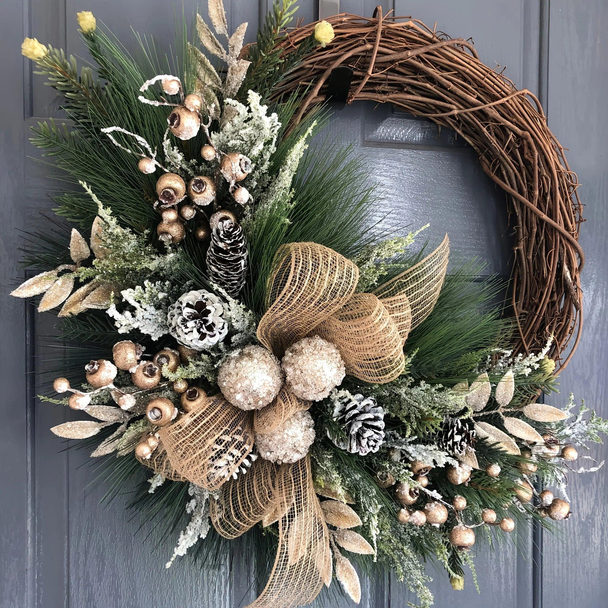 Plastic Christmas Wreath with Golden Accents and Pine Cones