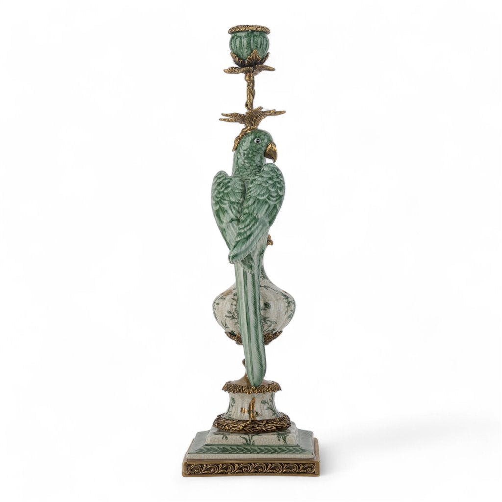 Decorative candle holder with parrot design on a white background