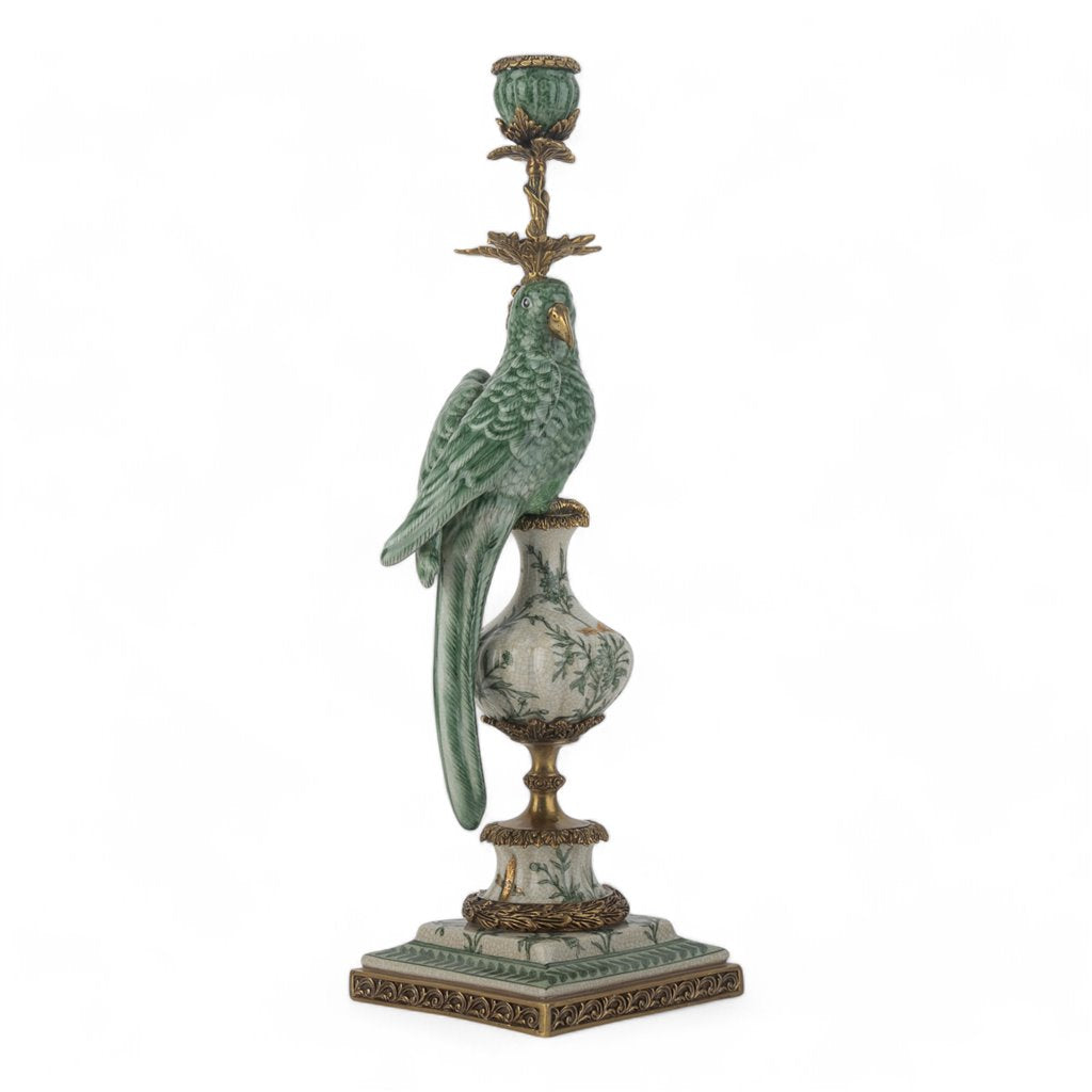 Decorative candle holder with a parrot figure on a white background