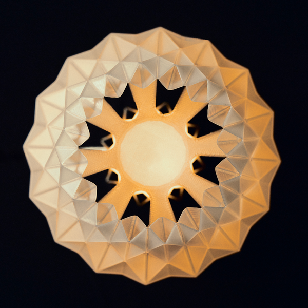 Decorative lamp with geometric design on a black background