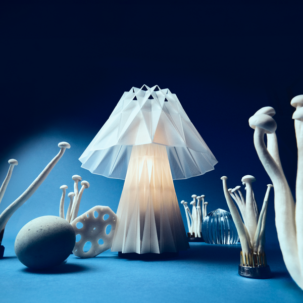 Futuristic mushroom-shaped lamp with a blue background