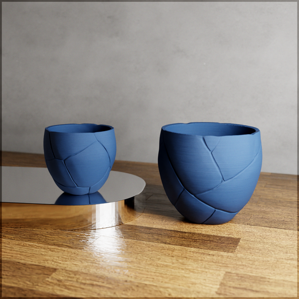 Two blue ceramic bowls on a wooden surface with a gray background