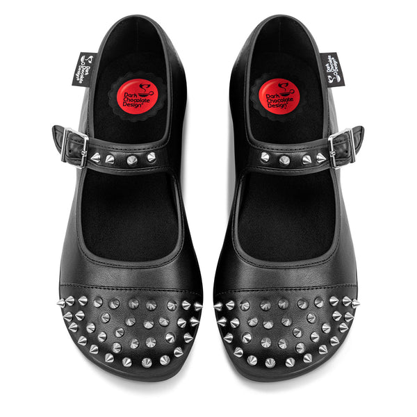Hot Chocolate Design Rebel Jane - Black studded shoes with buckles on a white background