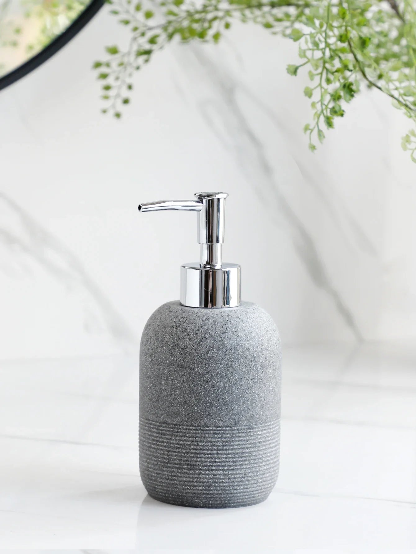 Grey soap dispenser with chrome pump from Buddify's 5Pcs Bathroom Accessories set, ideal for modern bathroom countertops.