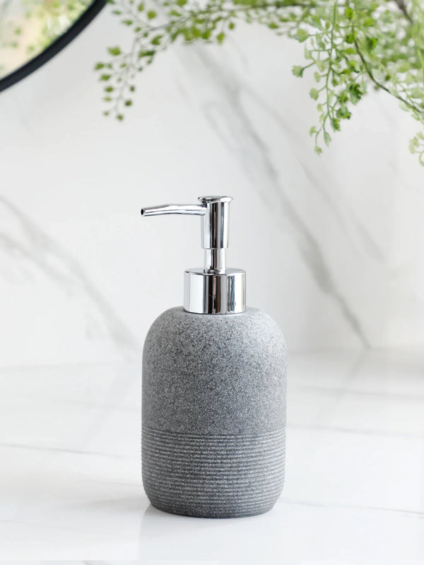 Grey soap dispenser with chrome pump from Buddify's 5Pcs Bathroom Accessories set, ideal for modern bathroom countertops.