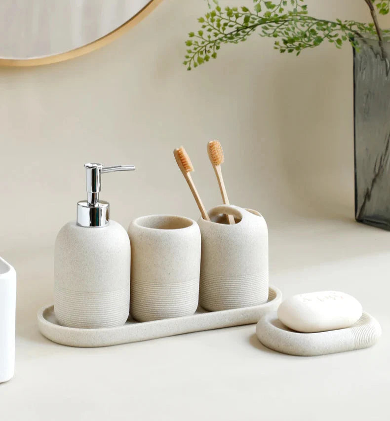 Stylish beige 5Pcs Bathroom Accessories set by Buddify with soap dispenser, tumbler, toothbrush holder, and soap dish on tray.