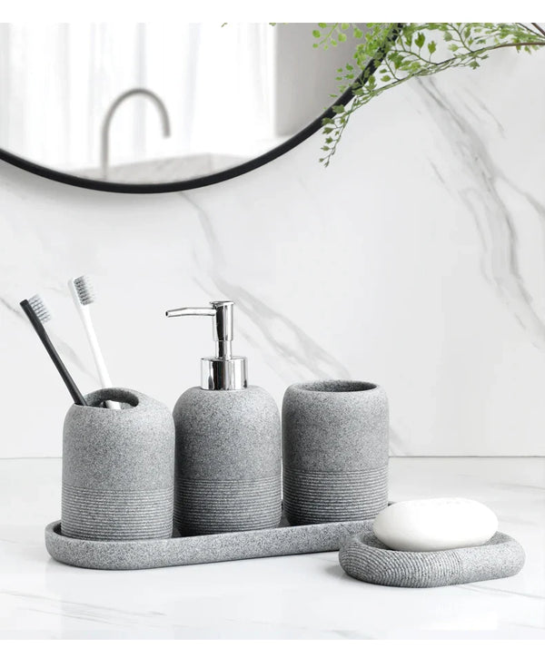 Grey 5Pcs Bathroom Accessories set by Buddify with soap dispenser, tumbler, toothbrush holder, and soap dish on tray in modern bathroom.