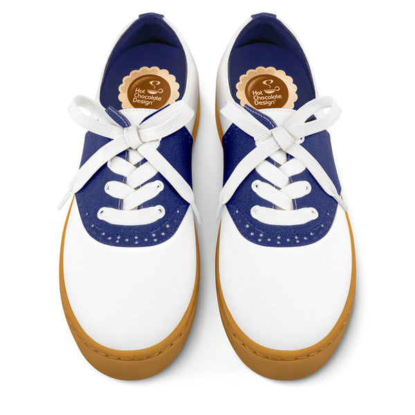 Hot Chocolate Design Pair of blue and white sneakers with brown soles on a white background