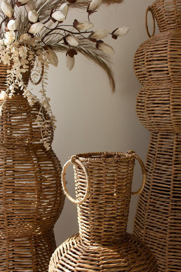 SET OF THREE WOVEN SEAGRASS AND IRON FLOOR VASES