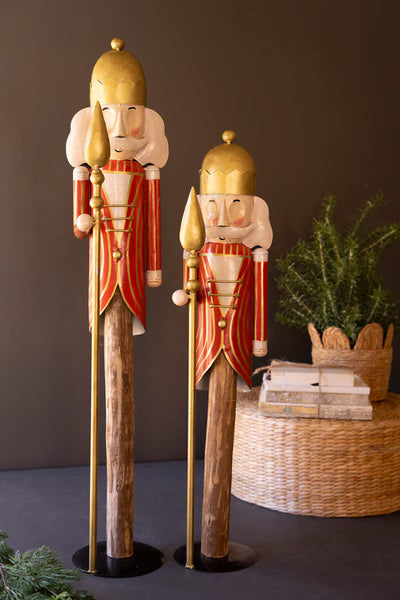 SET OF TWO PAINTED METAL NUTCRACKERS ON WOOD BASES