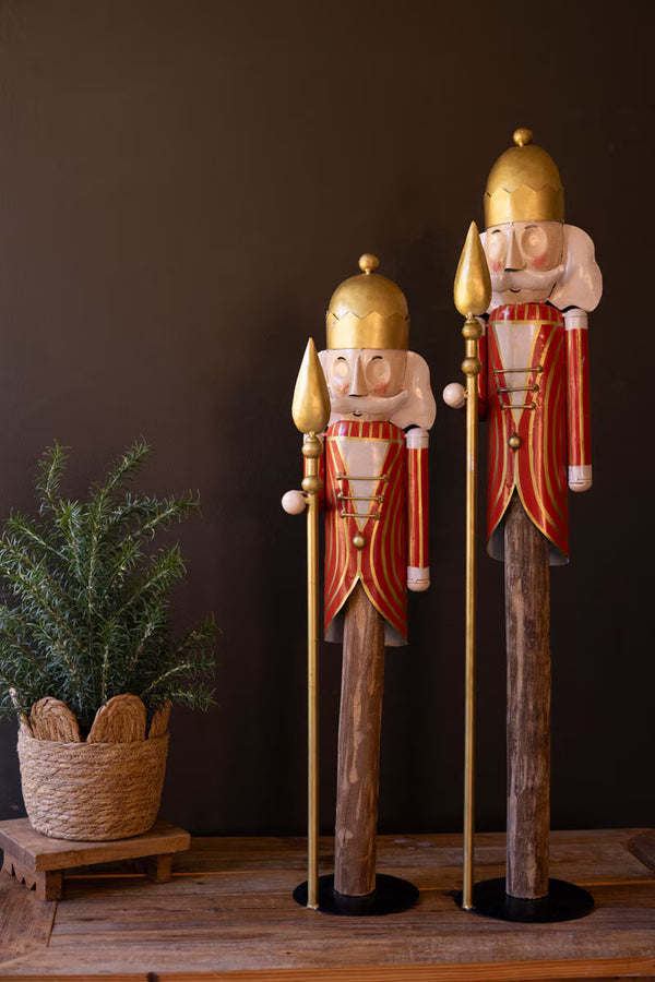 SET OF TWO PAINTED METAL NUTCRACKERS ON WOOD BASES