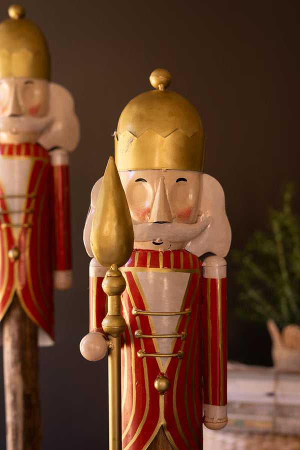 SET OF TWO PAINTED METAL NUTCRACKERS ON WOOD BASES