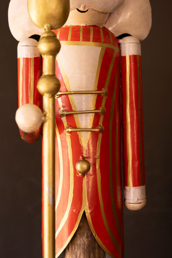 SET OF TWO PAINTED METAL NUTCRACKERS ON WOOD BASES