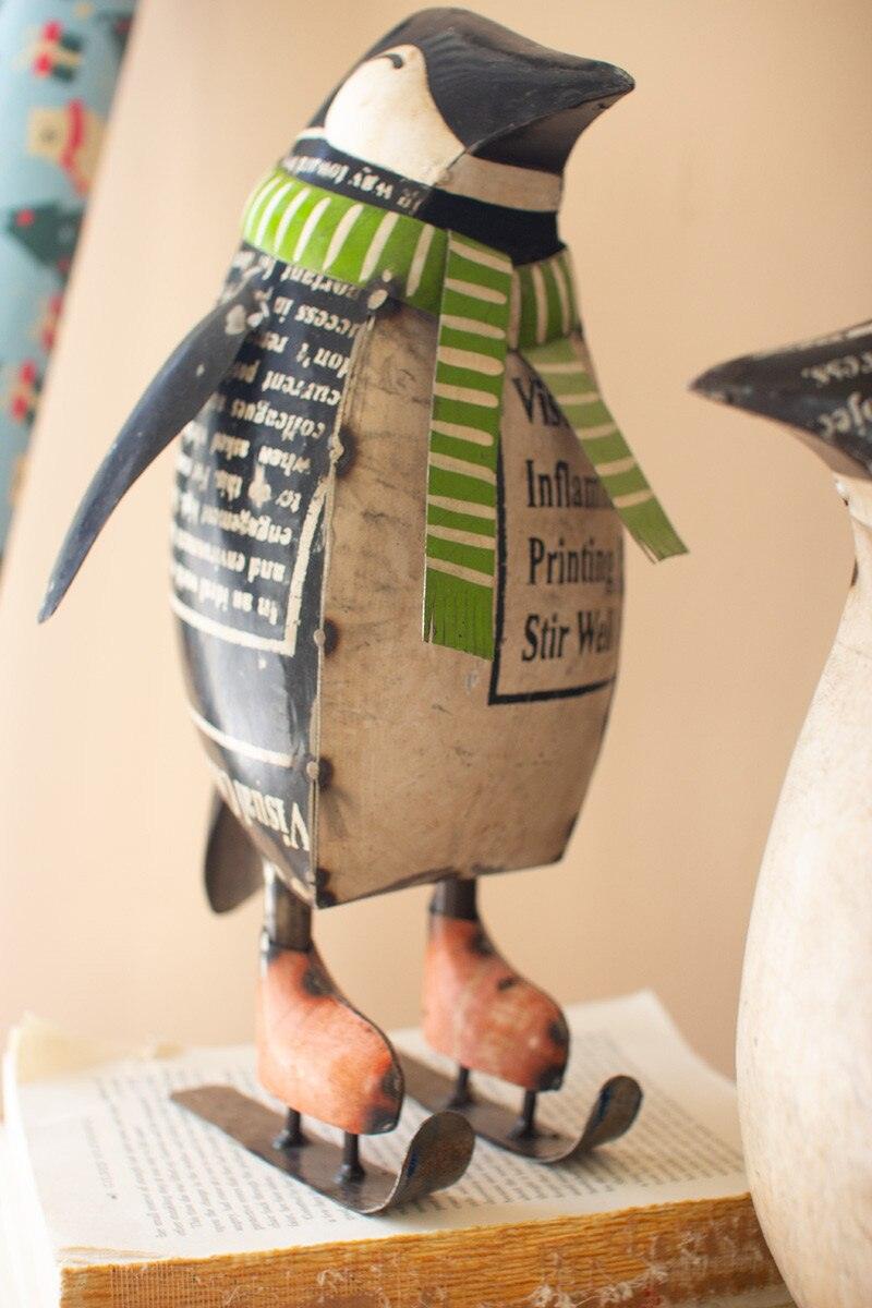 SET OF TWO RECYCLED METAL SKATING CHRISTMAS PENQUINS