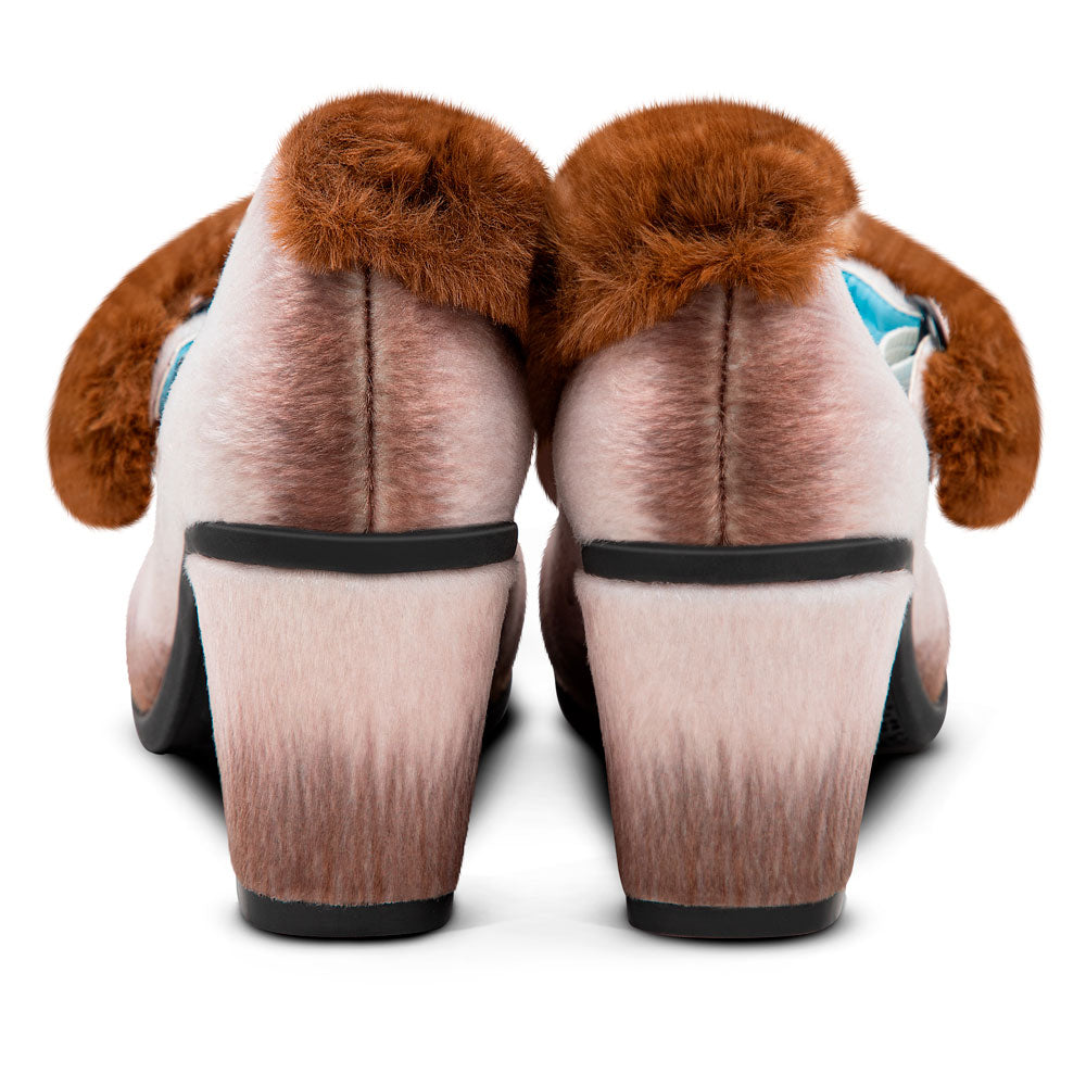 Pair of dog-shaped slippers with brown fur and black soles on a white background