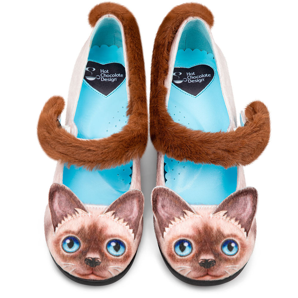 Shoes with cat face design and fluffy brown accents on a white background