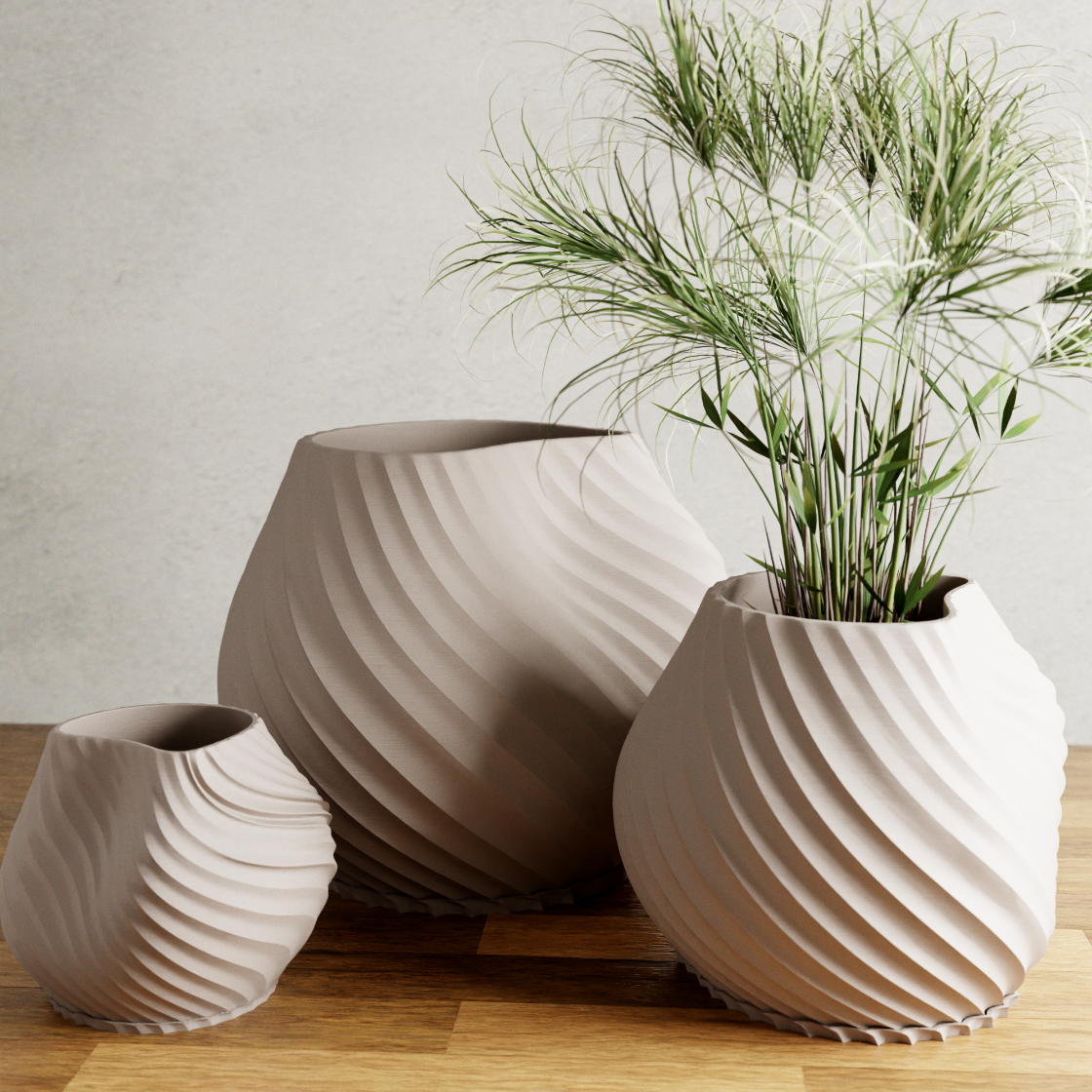 Three ceramic planters with textured surfaces on a wooden surface.