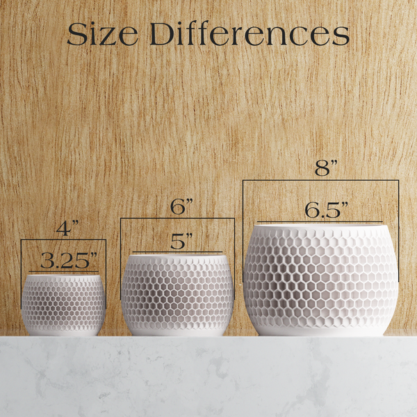 Three silver hexagonal patterned pots with measurements against a wooden background