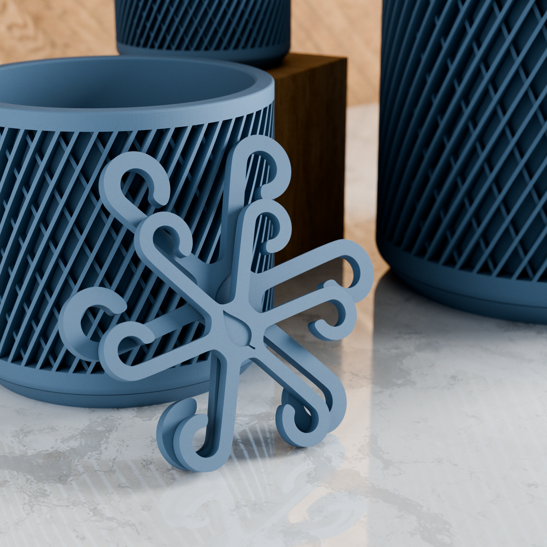 Decorative blue metal snowflake ornament on a textured surface with geometric-patterned containers in the background.