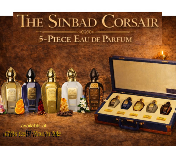 Set of five perfume bottles with a display case labeled 'The Sinbad Corsair 5-Piece Eau de Parfum' on a wooden background.
