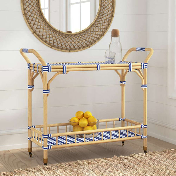 The Ventana Bamboo bar cart with decorative ribbons against a white wall.