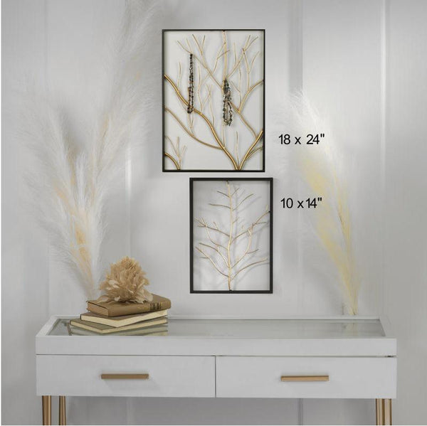Two framed wall art prints with gold branch designs are displayed above a white console table in a styled interior. One print is labeled 18 x 24 inches and the other 10 x 14 inches.
