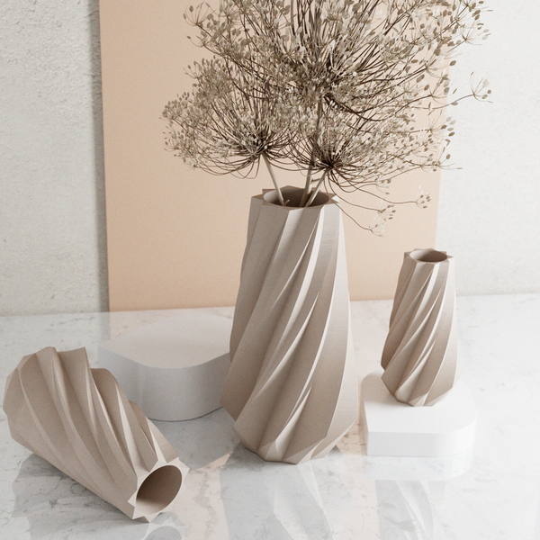Set of modern ceramic vases on a light surface with a neutral background