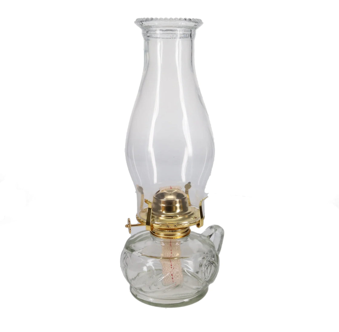 Clear glass oil lamp with brass base on a white background
