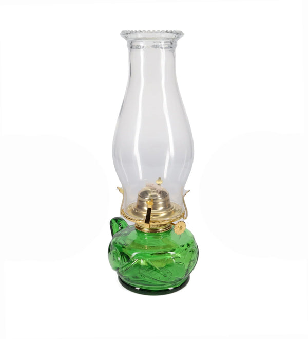 Green oil lamp with clear glass chimney on a white background