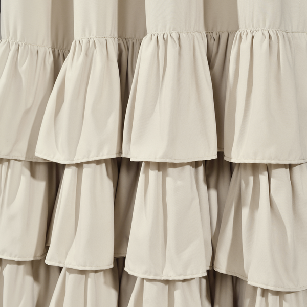 Close-up of beige ruffled curtains