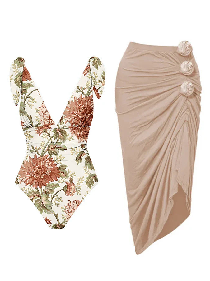 A floral and animal print one-piece swimsuit with a vintage style, displayed next to a matching cover-up with a floral design.