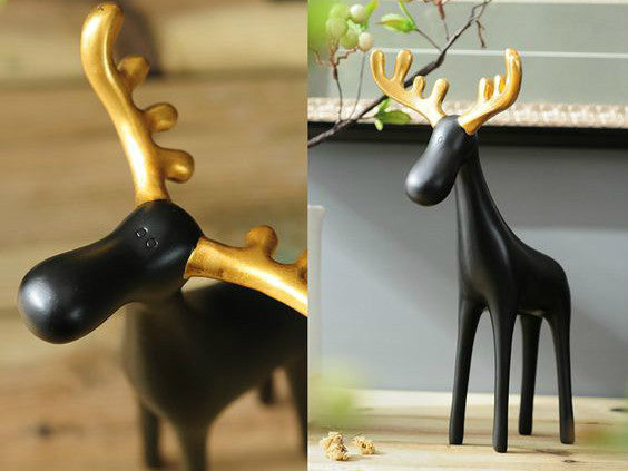 Family of Three Black Reindeer Sculptures with Golden Antlers