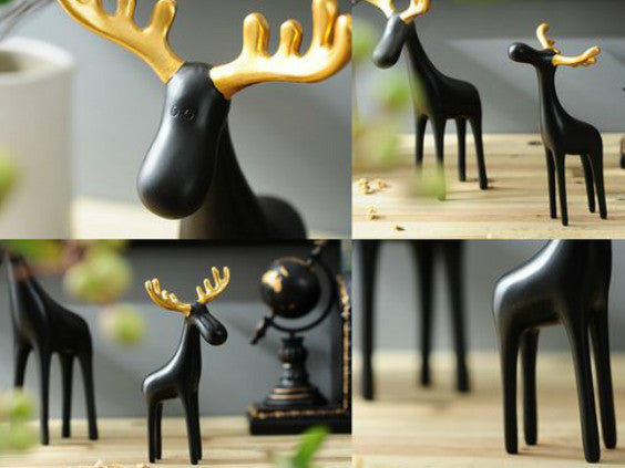 Family of Three Black Reindeer Sculptures with Golden Antlers