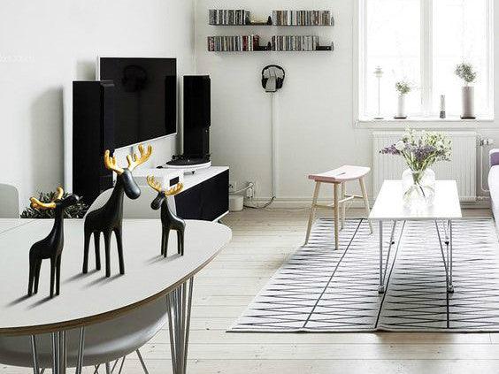Family of Three Black Reindeer Sculptures with Golden Antlers