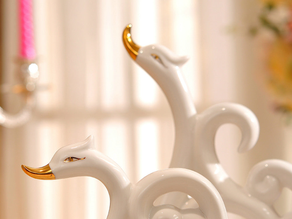 Pair of White Porcelain Swans with Decorative Wings