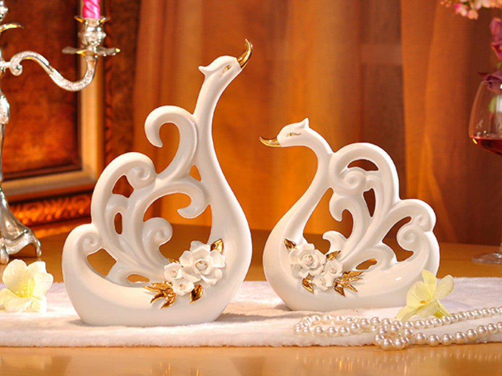 Pair of White Porcelain Swans with Decorative Wings