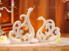Pair of White Porcelain Swans with Decorative Wings