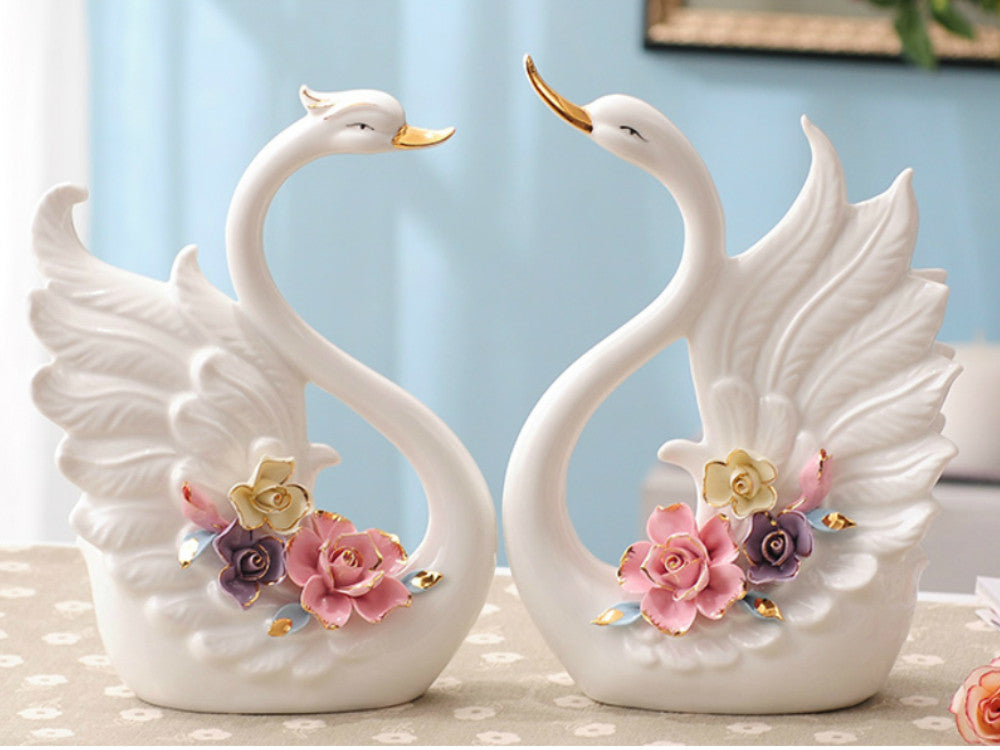 Pair of Porcelain Swans with an Arrangement of Pinched Multi-Color Roses