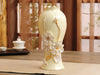 Off-White Porcelain Vase with Pinched Golden stem and White Flowers