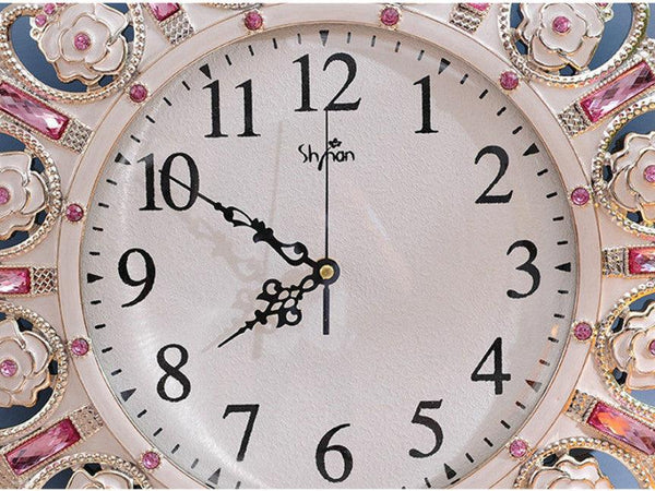 Metallic Gold Clock with Pendulum adorned with Pink Stone Accents