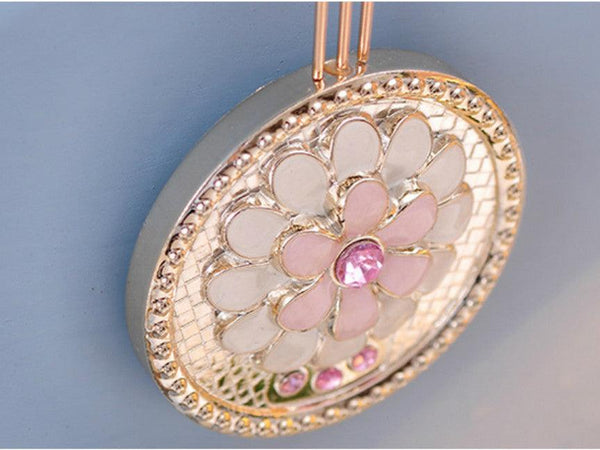 Metallic Gold Clock with Pendulum adorned with Pink Stone Accents
