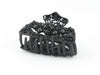 Black metal hair claw clip with black stones on a tiny floral pattern