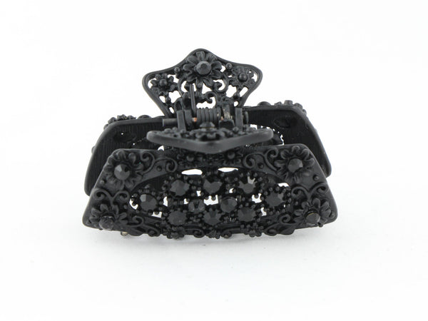 Black metal hair claw clip with black stones on a tiny floral pattern