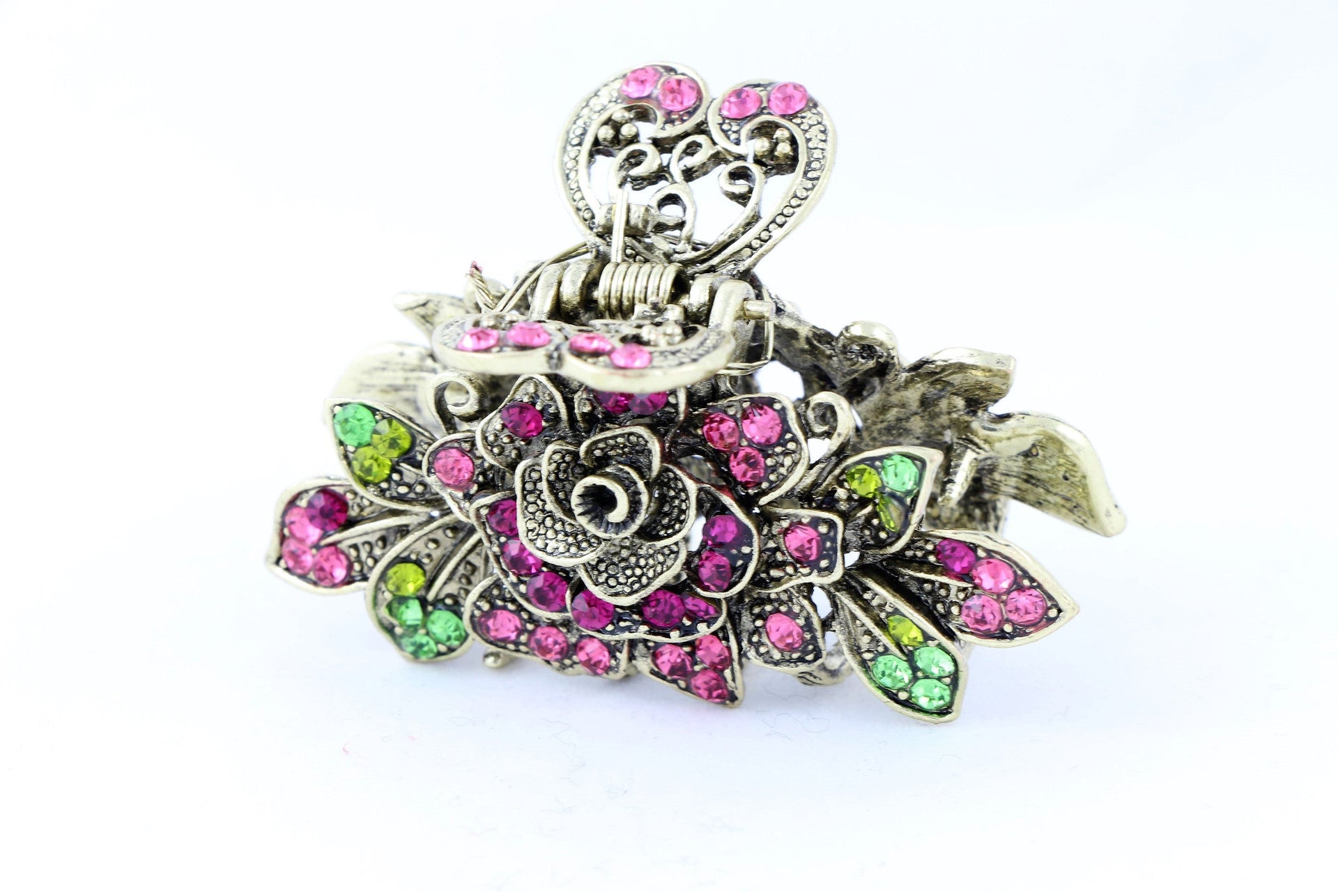 Antique bronze finish hair claw clip on a rose with pink stone petals