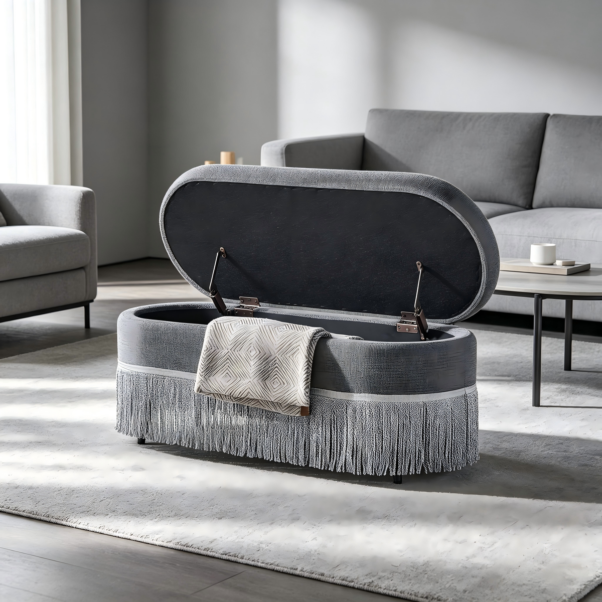 Oval Upholstered Storage Ottoman with Fringe Trim & Lift-Top Lid